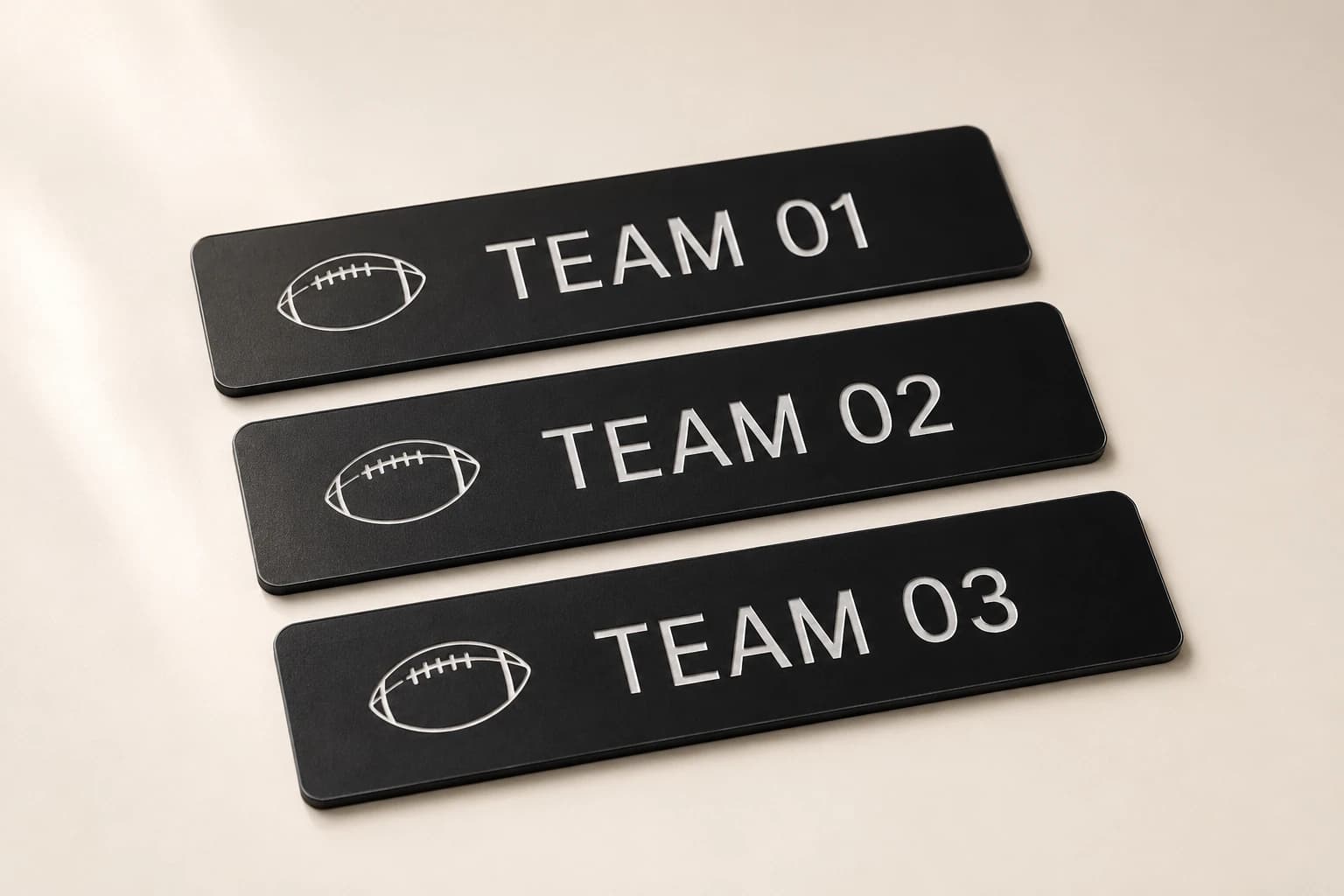 Three black acrylic draft-board strips with numbered team fields.
